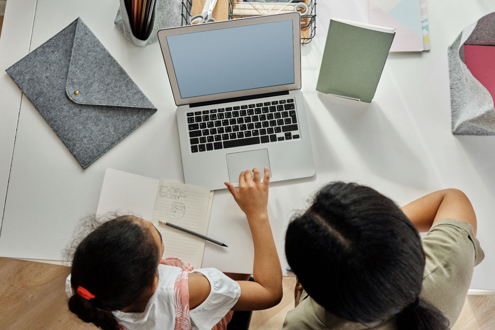 Parent helping child with homework
