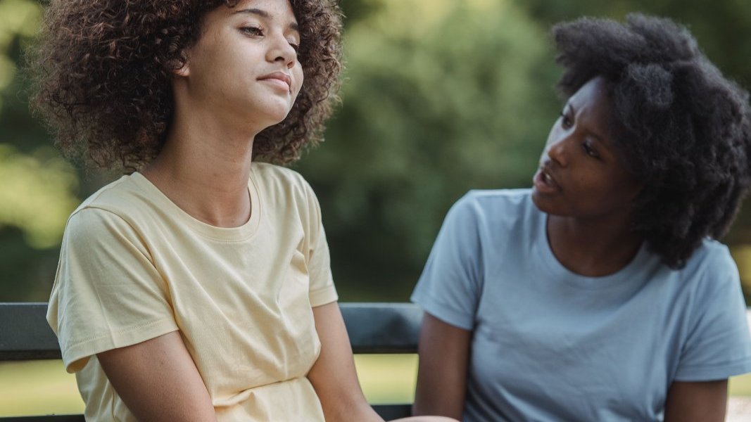A Black girl expressing her emotions thoughtfully.