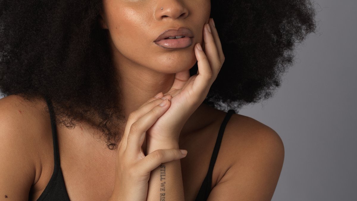 Black woman looking thoughtful