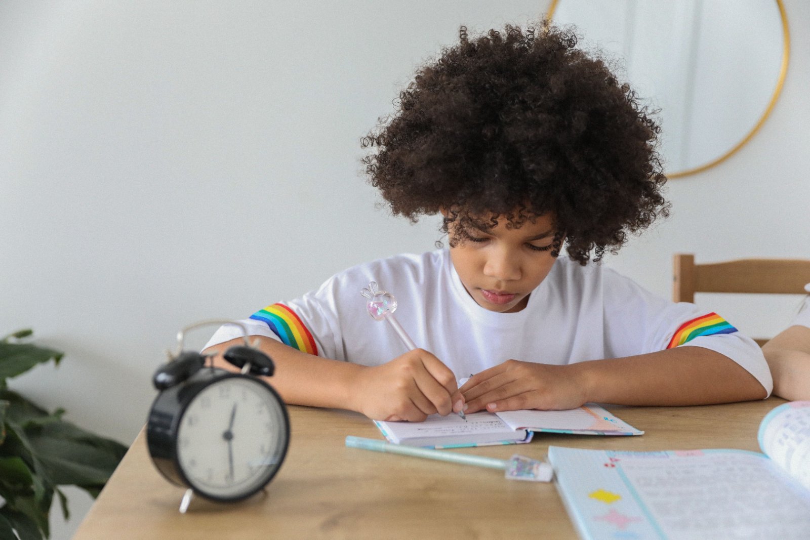 Black professional with child during structured learning activity