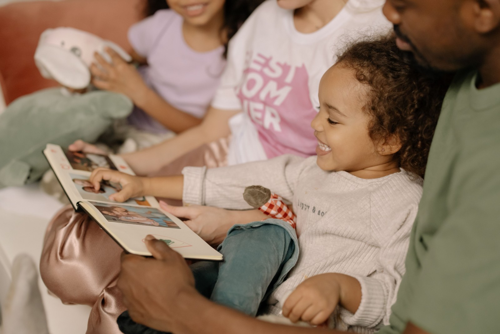 A thoughtful Black woman reflecting on her childhood memories.