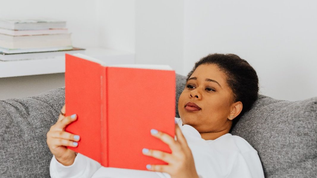 A Black woman taking a peaceful moment to herself.