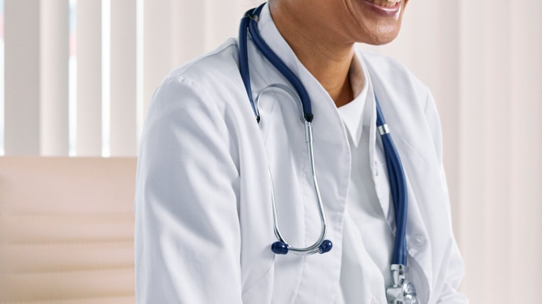 A Black woman looking anxious in a medical office.