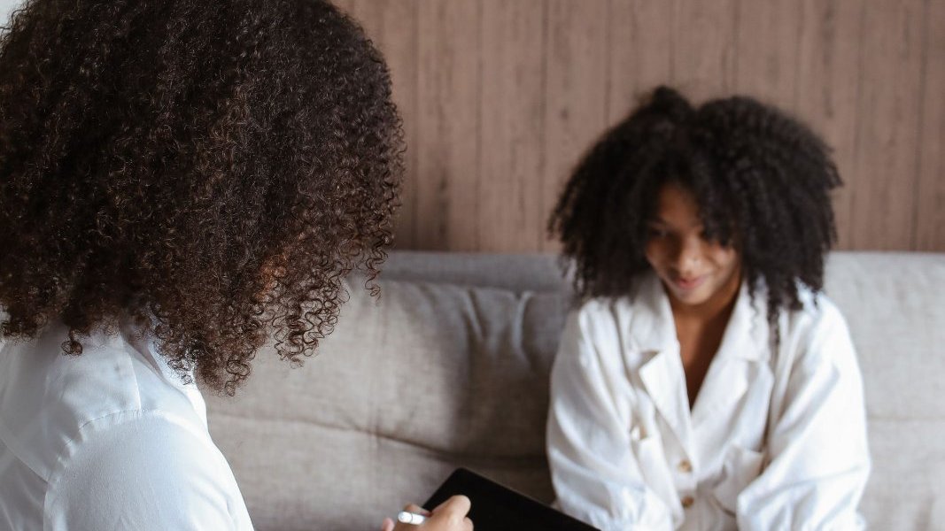 A group of Black women supporting each other.
