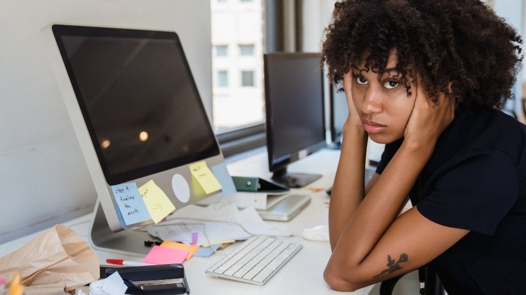 Black woman reflecting on her mental health.
