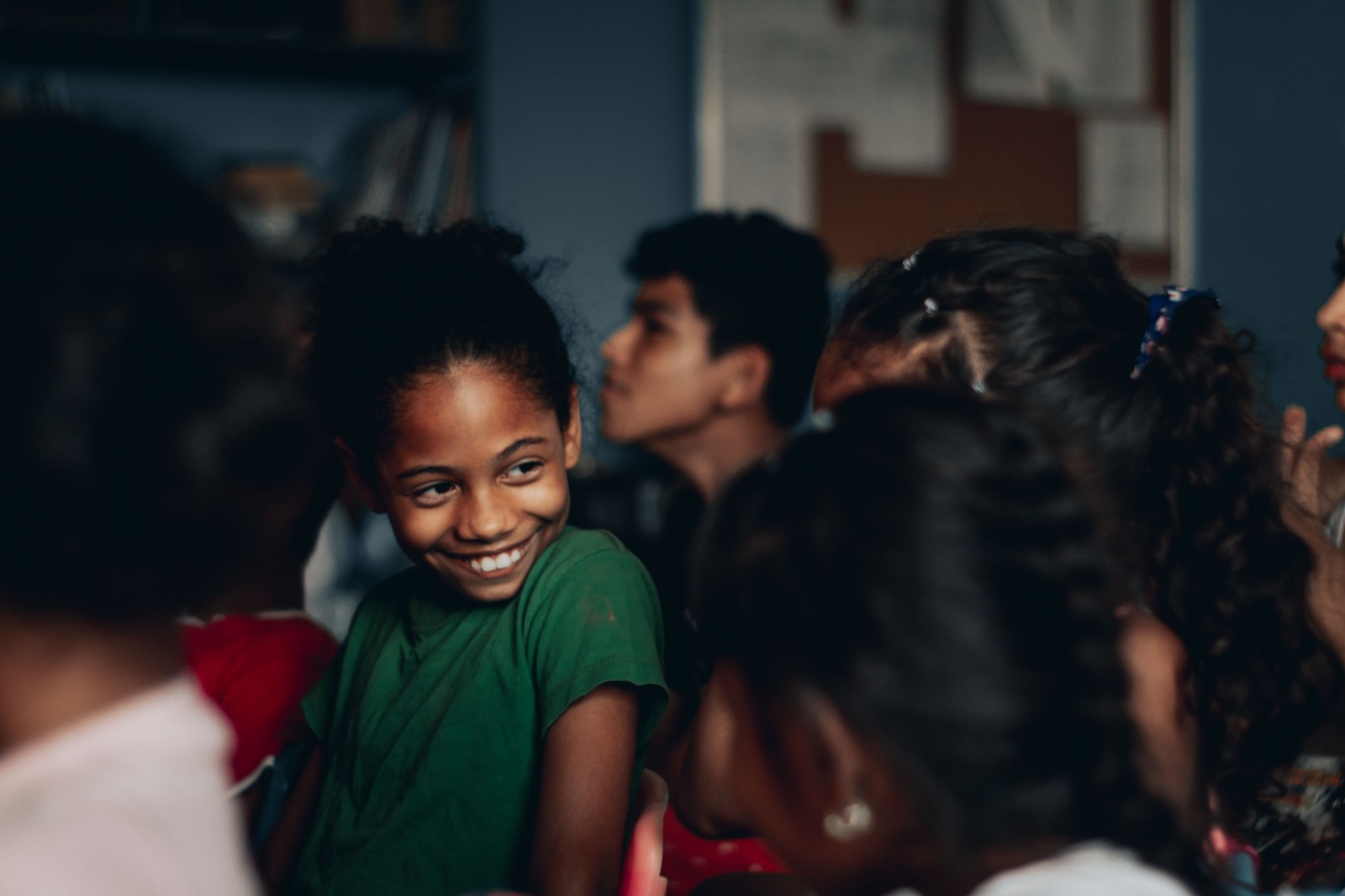 Black girl looking thoughtful while talking to her parent.