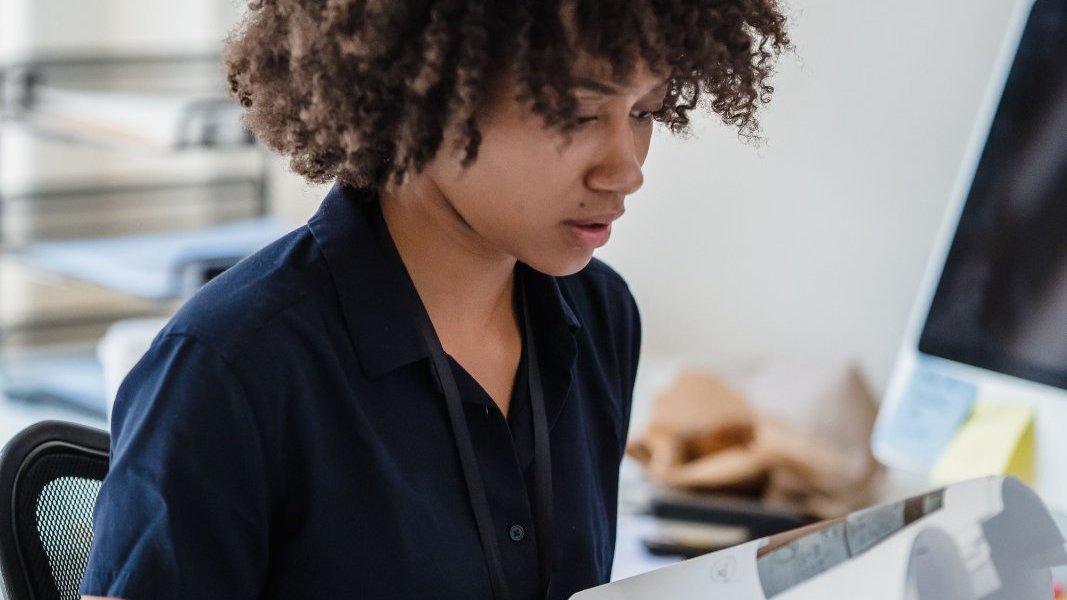 A person reviewing an evaluation report