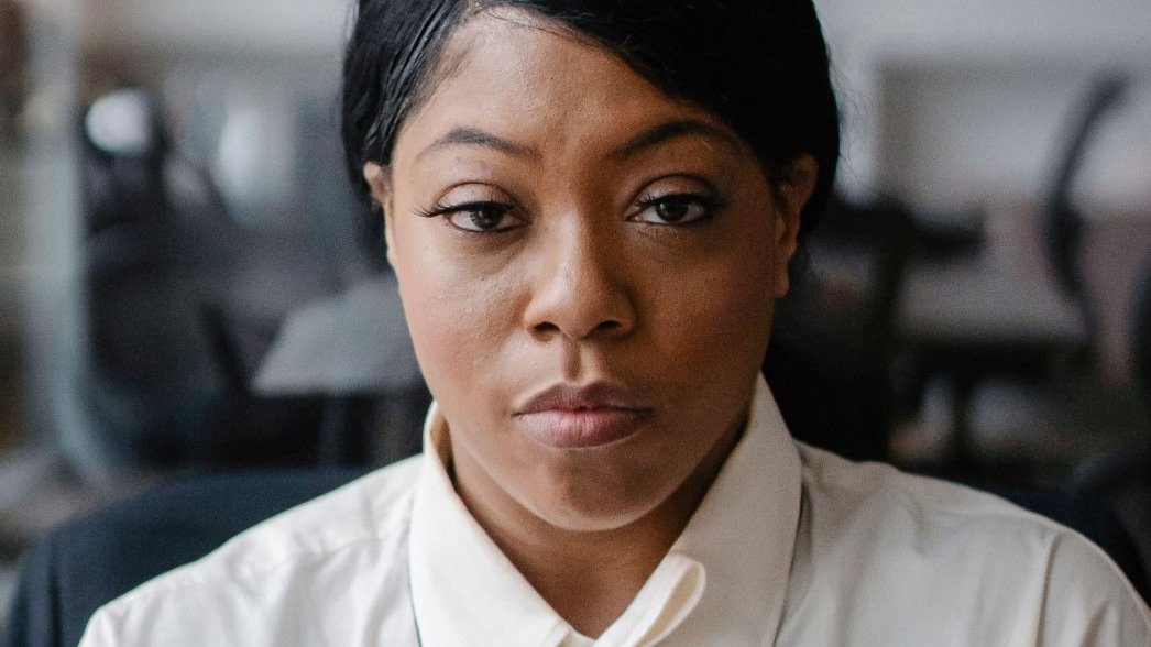 Black woman reflecting on her accomplishments
